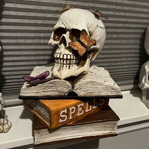 Halloween decoration skull with spell books